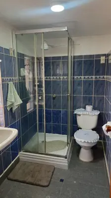 a bathroom with a shower and a toilet at Cozy Mini-Apartment-Cusco in Cusco
