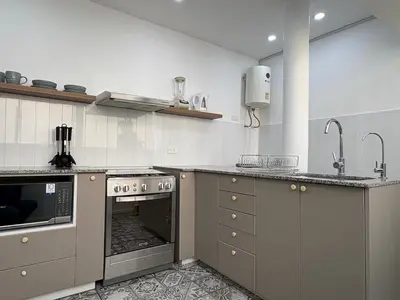 a kitchen with a sink and a stove top oven at 2Br Apartment Miraflores in Lima