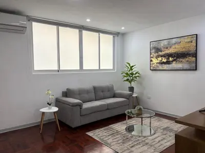 a living room with a couch and two tables at 2Br Apartment Miraflores in Lima