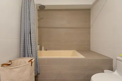 a bathroom with a tub and a toilet at Duplex in the best area of Barranco in Lima