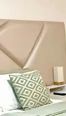 a bed with a pillow and a lamp on it at Inka Home VIP Luxury total 2 Private parking spaces in Lima