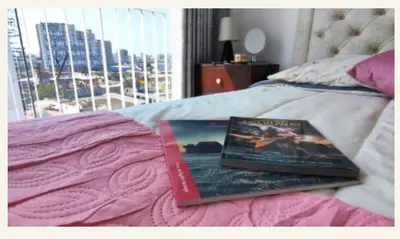 a book sitting on top of a bed at Milyshomeperu in Lima