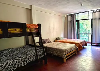 a bedroom with two bunk beds and a window at Casa de campo familiar cn parrilla, WiFi y piscina