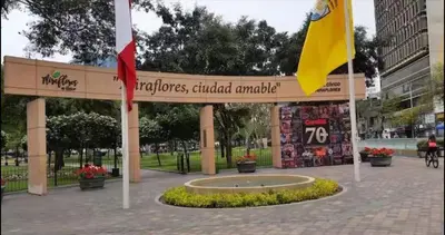a pavilion with a flag and a sign in a park at Exclusive apartment in Miraflores in Lima