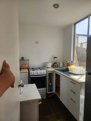 a kitchen with a stove and a counter top at Apartamento duplex en ICA in Pueblo Nuevo