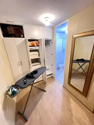a room with a table and a mirror in it at Downtown apartment in a residential area in Lima in Lima