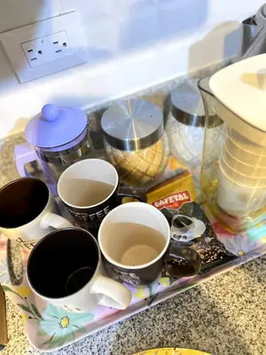a tray filled with cups of coffee on a counter at Downtown apartment in a residential area in Lima in Lima