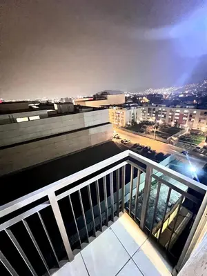a balcony with a view of a city at night at Downtown apartment in a residential area in Lima in Lima