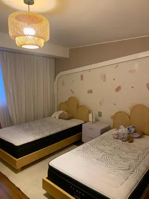 two beds in a room with hearts on the wall at Spacious apartment in Miraflores in Lima