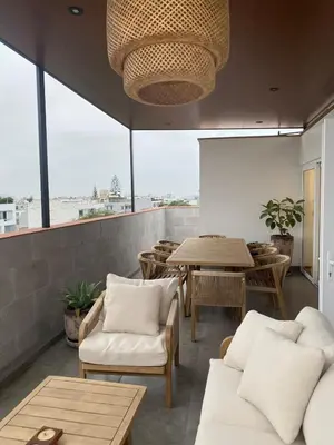 a living room with a table and chairs and a large window at Spacious apartment in Miraflores in Lima