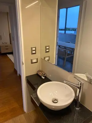 a bathroom with a sink and a mirror at Spacious apartment in Miraflores in Lima