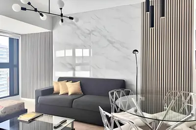 a living room with a couch and a table at Torre Black in Lima