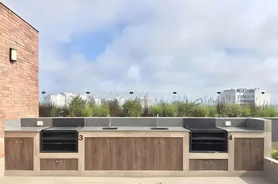 a kitchen island with a counter top on top of a building at Torre Black in Lima