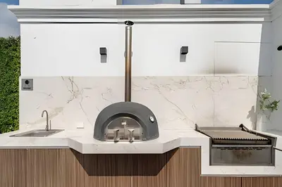 a kitchen with a stove top oven in a counter at Edificio The Classic in Lima