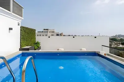 a swimming pool on the roof of a building at Edificio The Classic in Lima