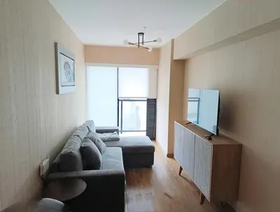 a living room with a couch and a tv at MiniHome Pietra di Prado in Lima