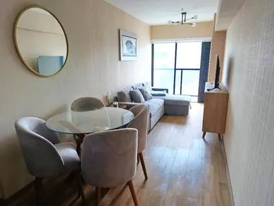 a living room with a couch and a table and a mirror at MiniHome Pietra di Prado in Lima