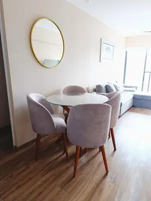 a dining room with a table and chairs and a mirror at MiniHome Pietra di Prado in Lima