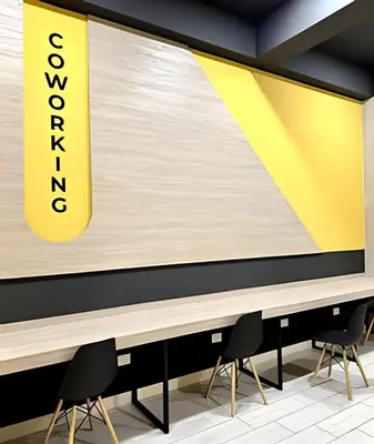 a large projection screen in a room with chairs at Torre Gold in Lima