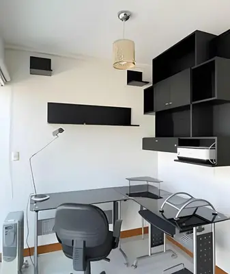 an office with a desk and a chair at Iconic Miraflores Penthouse 3BR in Lima