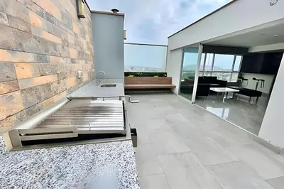 a bedroom of a house with a bed and a table at Modern Apartment between Miraflores & Surquillo in Lima