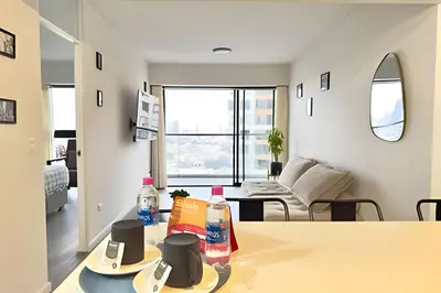 a living room with a table with drinks on it at Torre Platinium in Lima