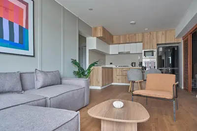 a living room with a couch and a table at Celestra by Geko in Lima