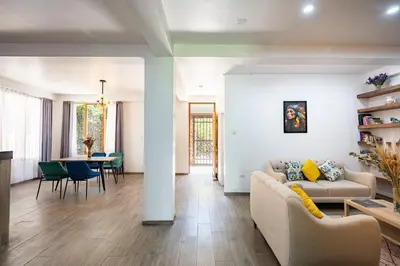 a living room with a couch and a table at Rural Retreat with Charming Patio 2 Bedrooms in Urubamba