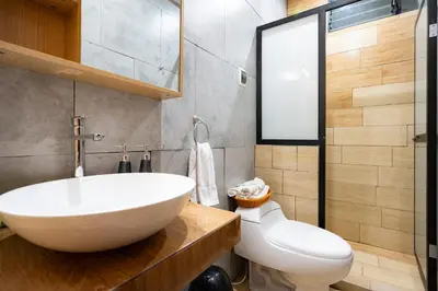a bathroom with a white sink and a toilet at Rural Retreat with Charming Patio 2 Bedrooms in Urubamba