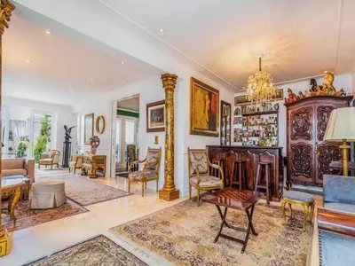 a living room filled with furniture and a chandelier at Apartment in the historic central of the city in Cusco
