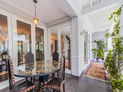 a dining room with a glass table and chairs at Apartment in the historic central of the city in Cusco