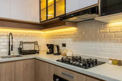 a kitchen with a stove and a counter top at Montclair 2BR by Geko in Lima