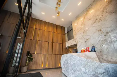 a room with a stone wall and a large bed at BSR Modern Spacious New Flat in Miraflores w/ Pool in Lima
