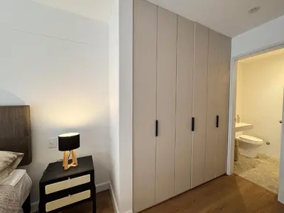 a bedroom with white cabinets and a bed at New 2D with Pool-Coworking-Gym in Miraflores in Lima