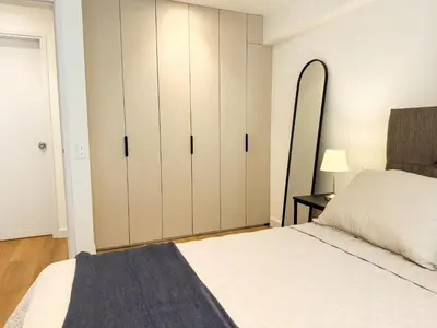 a bedroom with white cabinets and a bed at New 2D with Pool-Coworking-Gym in Miraflores in Lima