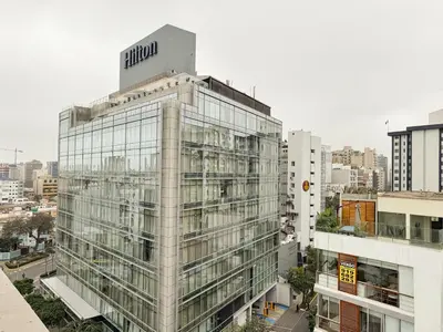 a tall building with a sign on top of it at New 2D with Pool-Coworking-Gym in Miraflores in Lima