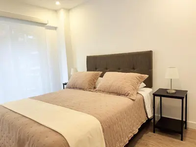 a bedroom with a large bed and a window at New 2D gym-grill Miraflores 1 block Malecón in Lima