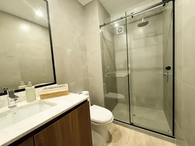 a bathroom with a shower and a toilet and a sink at New 2D gym-grill Miraflores 1 block Malecón in Lima
