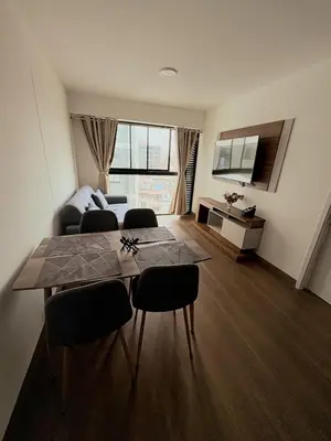 a living room with a table and chairs and a couch at Charming San Isidro Stay in Lima