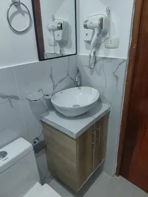 a bathroom with a sink and a mirror at Moderno Depa Céntrico en Abancay in Abancay