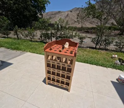 a lego basket sitting on a sidewalk with a mountain in the background at Casa campo las Pecanas Huaral