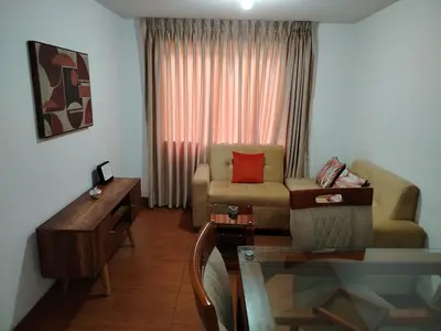 a living room with a couch and a table at Acogedor Departamento entero en Chorrillos in Lima