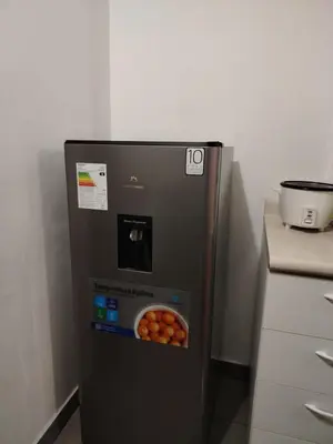 a refrigerator with a bowl of fruit in it at Acogedor Departamento entero en Chorrillos in Lima