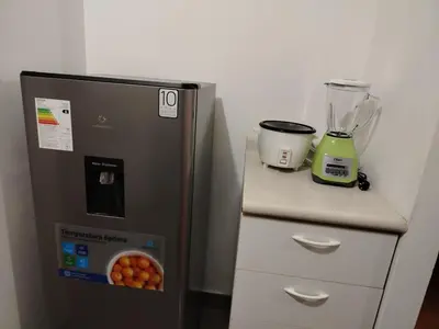 a blender sitting on top of a refrigerator at Acogedor Departamento entero en Chorrillos in Lima