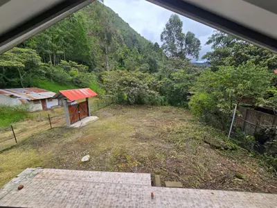 a view from the window of a house with a mountain at Casa familiar en Oxapampa hasta 5 personas con cochera in Oxapampa