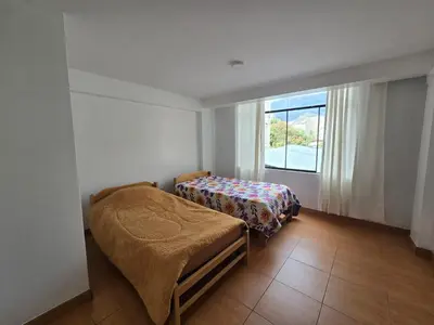 a bedroom with a bed and a window at 402G Modern equipped apartment in Abancay