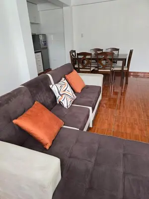 a living room with a couch with pillows on it at 402G Modern equipped apartment in Abancay