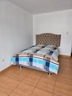 a bed in a bedroom with a wooden floor at 402G Modern equipped apartment in Abancay