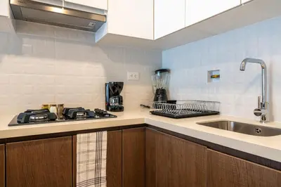 a kitchen with a sink and a counter top at The Sight by Geko in Lima