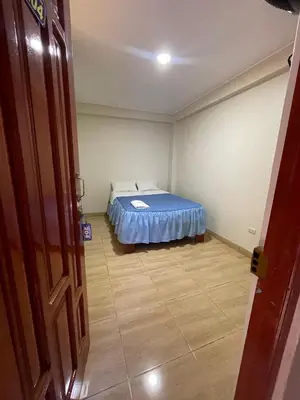 a small bedroom with a bed in a room at Misky Illari Hospedaje in Ica